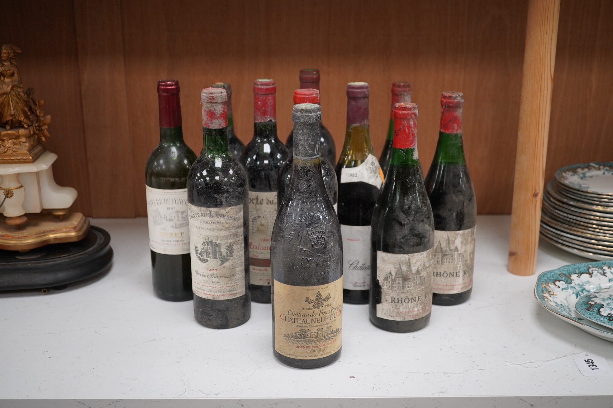 Eleven bottles of red wine to include two bottles of Porte du Roy, St-Emilion Grand Cru, 1990 and a bottle of Chateauneuf du Pape 1981 & 1982. Condition - storage unknown